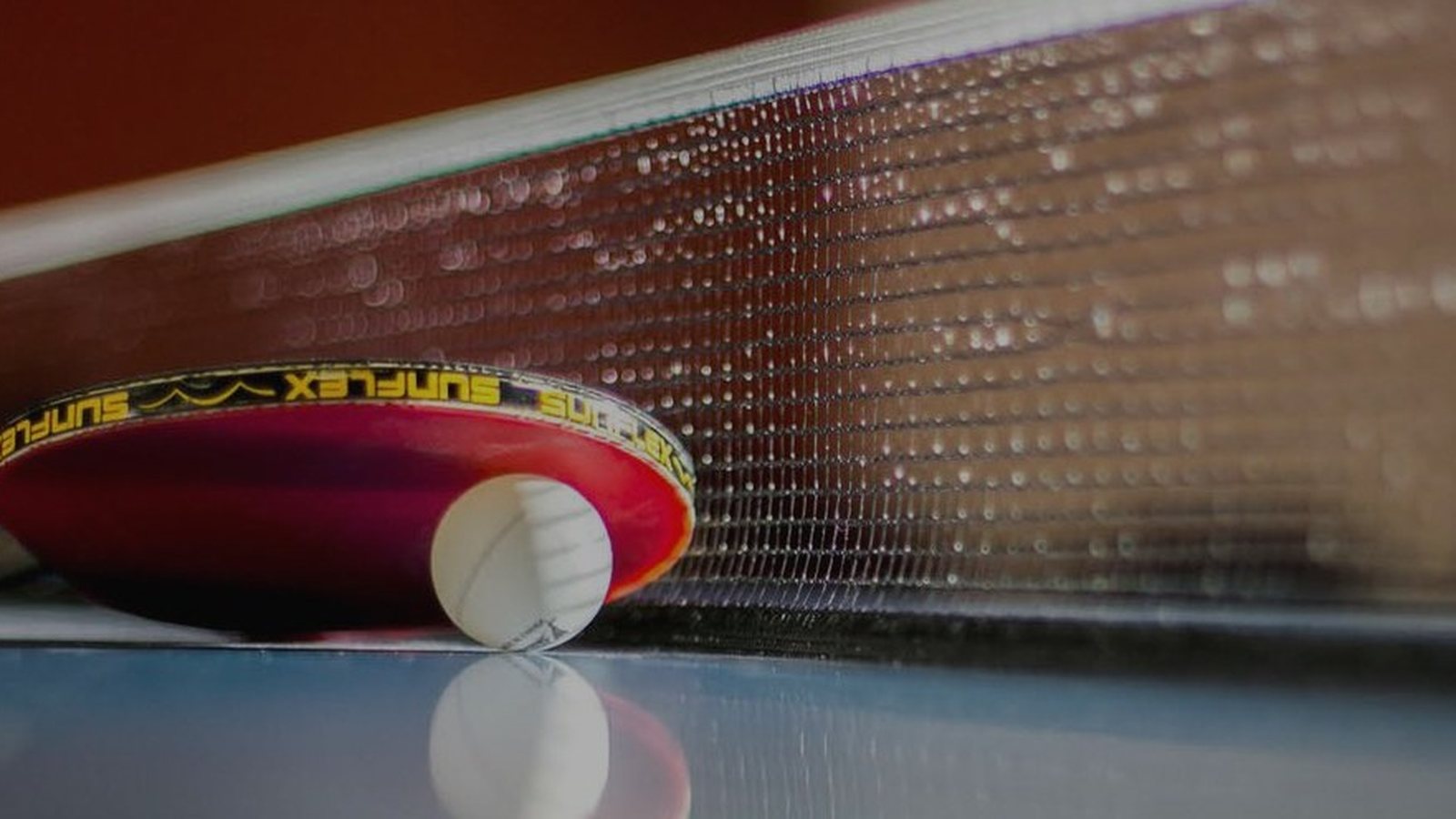 Table tennis paddle and ball at BATTS Athletic Burlington